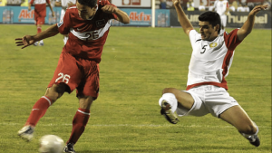 Turkey's Melvut Erdinc (L) vies for the ball with Armenia's Robert Arzmunanyan (white) during their World Cup 2010 qualifying match in Yerevan on September 6, 2008.